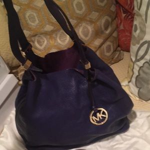 Purple leather handbag